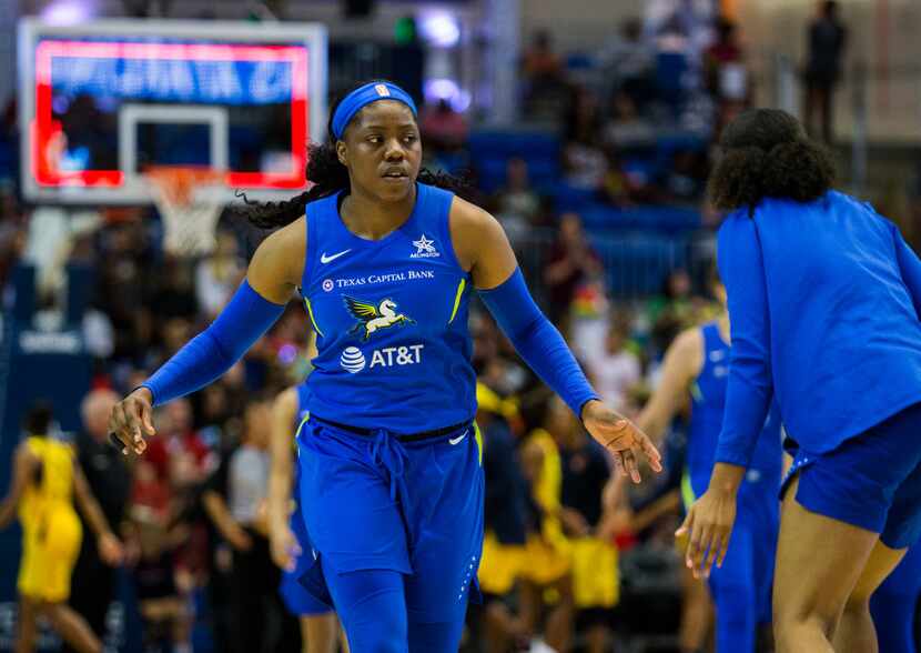 Dallas Wings guard Arike Ogunbowale (24) walks off the court at halftime of a WNBA game...
