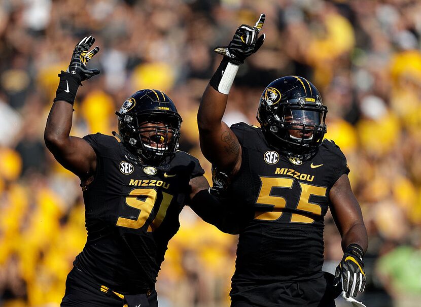 COLUMBIA, MO - SEPTEMBER 24:  Defensive end Charles Harris #91 and defensive lineman Jordan...