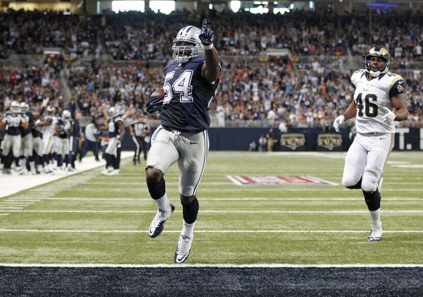 FILE - Dallas Cowboys outside linebacker Bruce Carter (54) celebrates as he makes his way to...