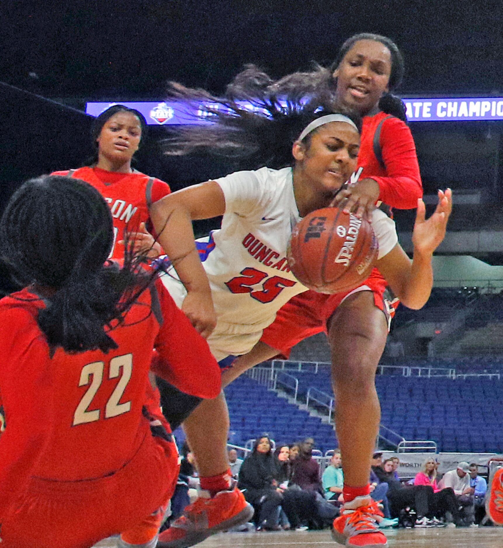 Duncanville guard Deja Kelly #25 is fouled by Judson guard Jonmecia Baskin #34 in a 6A...