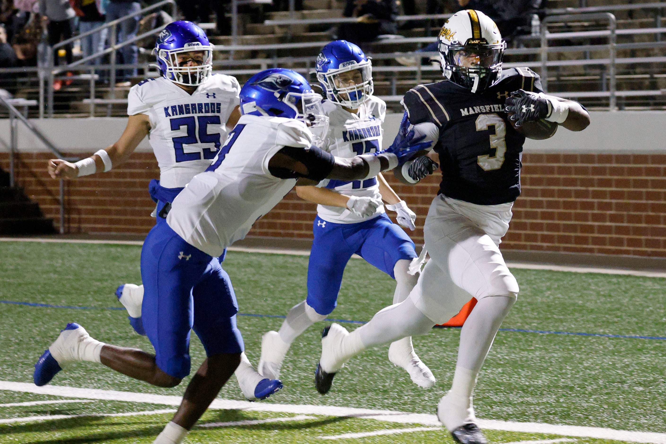 Mansfield's Teddy Clark (3) runs into the end zone for a touchdown as Weatherford's Kaddilac...