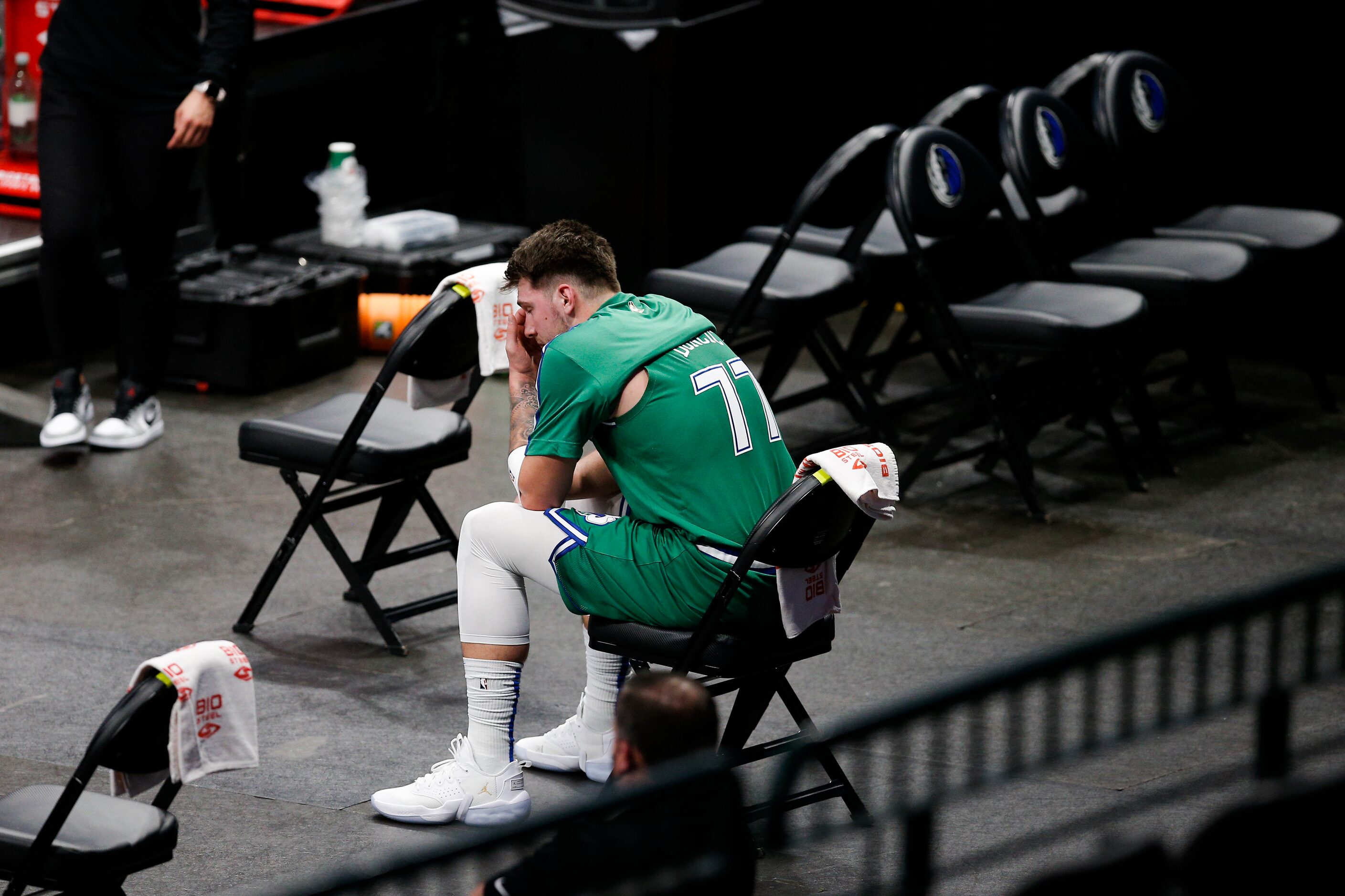 Dallas Mavericks guard Luka Doncic (77) looks on from the bench after committing a technical...