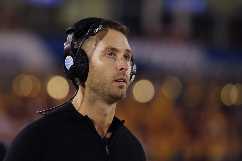 FILE - In this march 24, 2013, file photo, Texas Tech head coach Kliff Kingsbury, center,...
