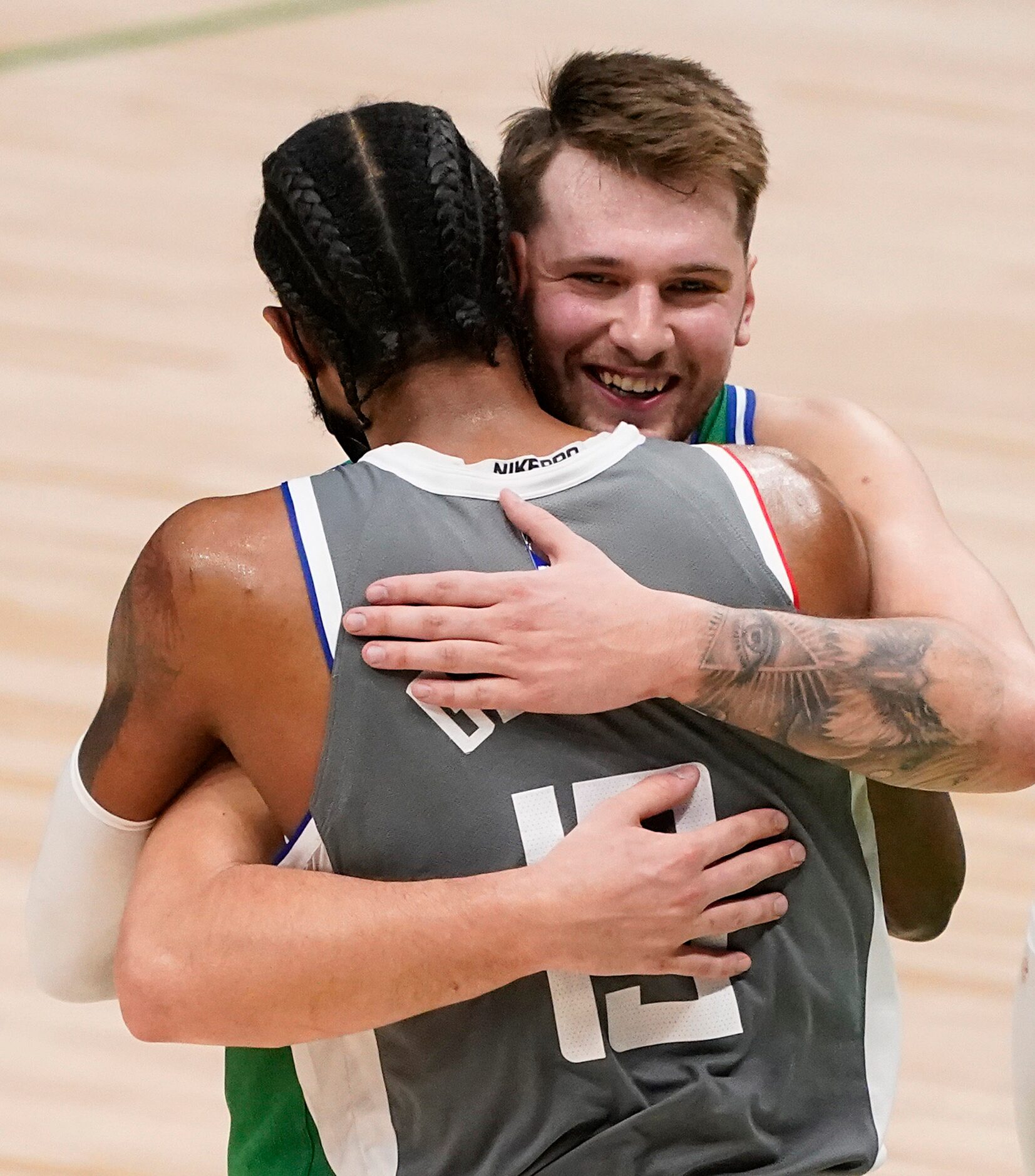 Dallas Mavericks guard Luka Doncic hugs LA Clippers guard Paul George after the Mavericks...