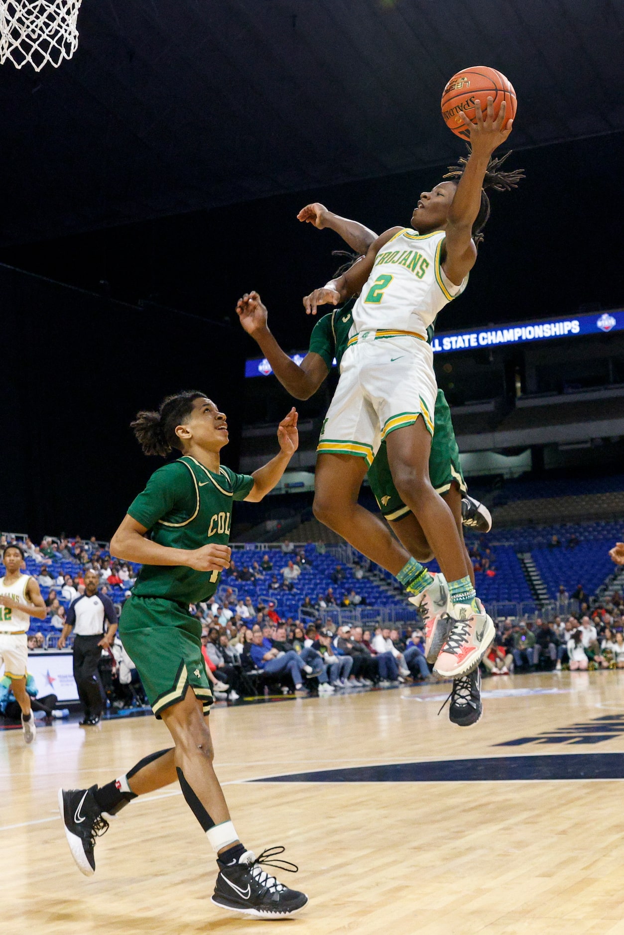 Madison guard Kardae Turner (2) leaps for a layup against San Antonio Cole guard Silas...