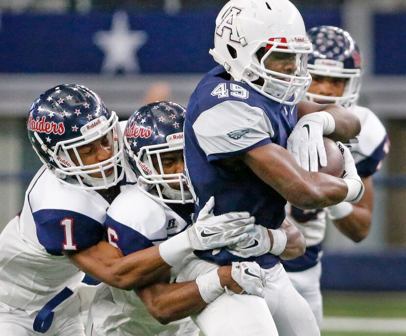 Allen running back Kirby Bennett (45) rumblers for yardage a s host of Ryan defenders...