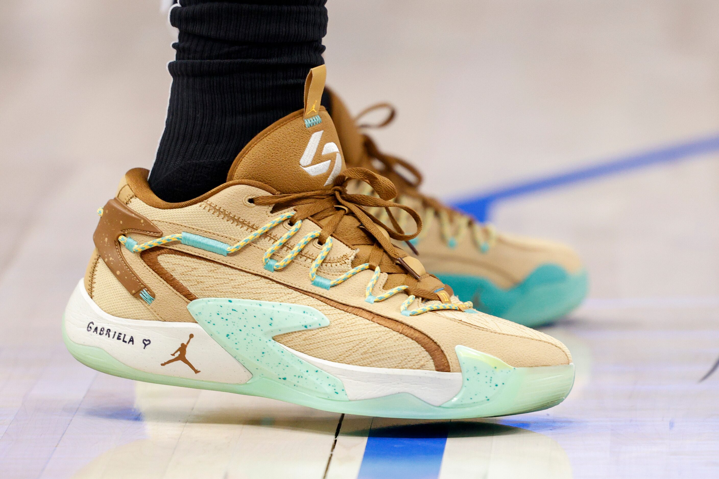 Dallas Mavericks guard Luka Doncic (77) wears the name of his daughter Gabriela on his shoes...