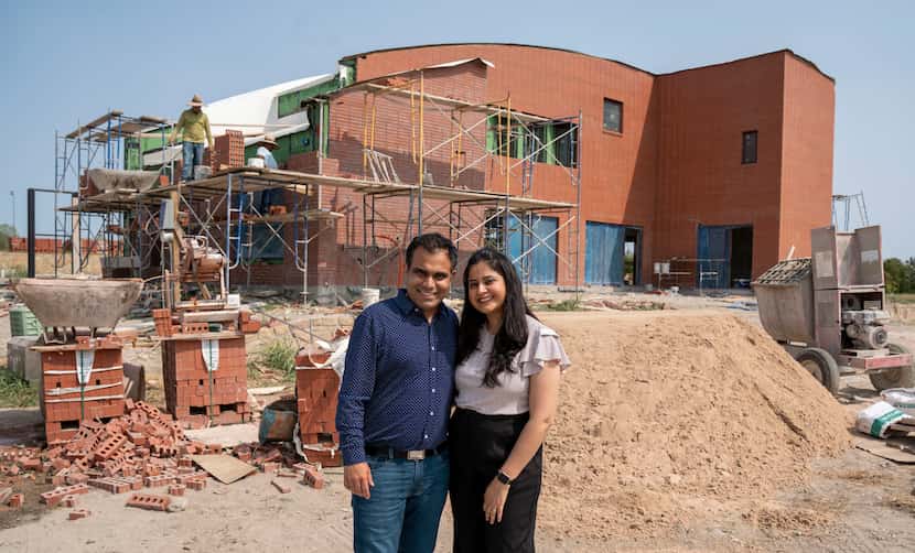 Ravi & Harshika Vanjani stand in front of their future home in the Tapestry neighborhood in...