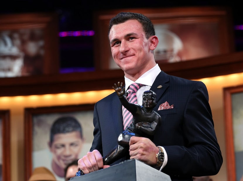 Quarterback Johnny Manziel of the Texas A&M University Aggies poses with the Heisman...