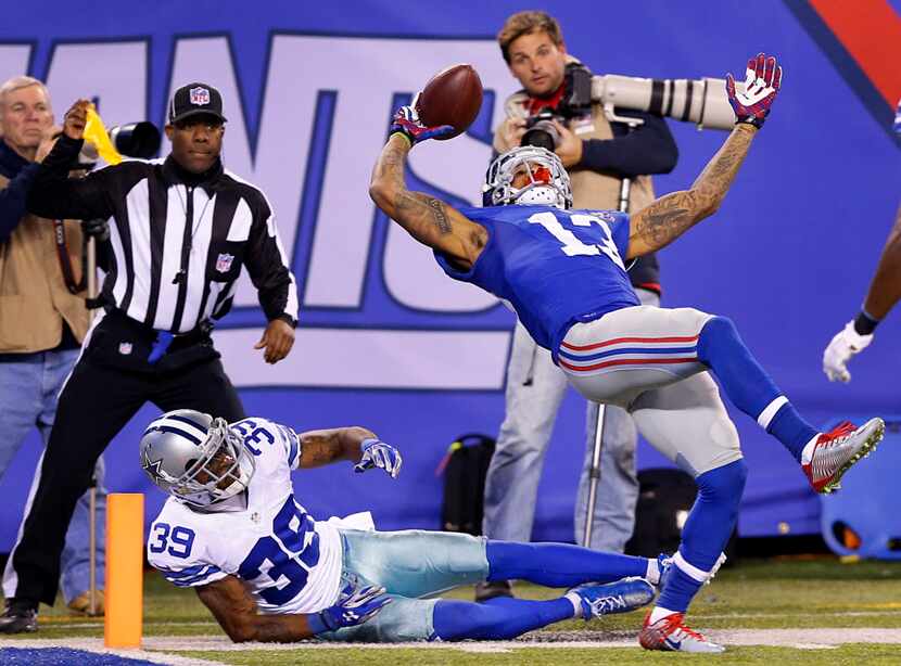 Despite the pass interference by Dallas Cowboys cornerback Brandon Carr (39), New York...