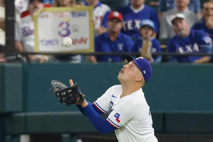 Texas Rangers first baseman Nathaniel Lowe (30) catches a pop-up from Arizona Diamondbacks'...