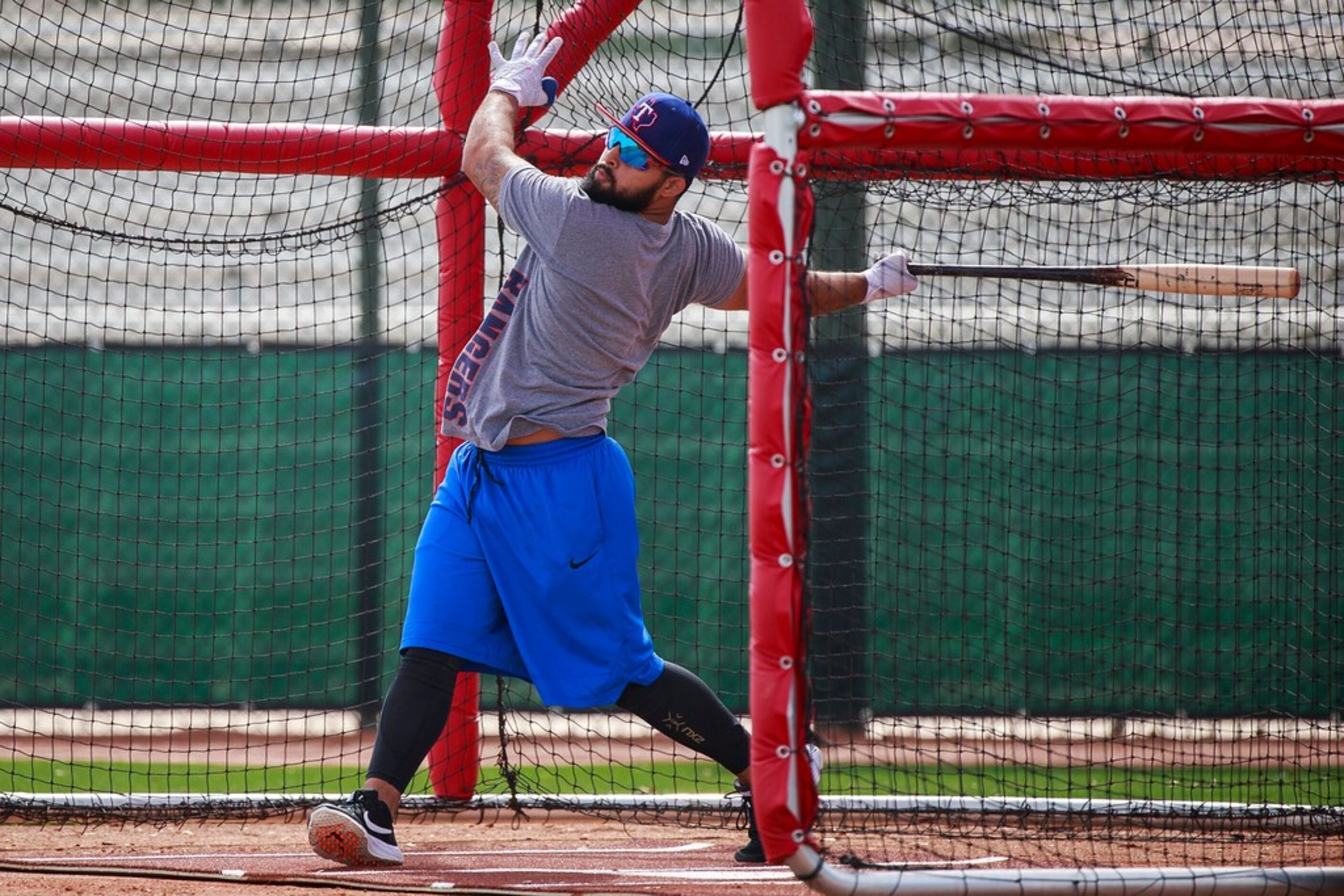 Texas Rangers infielder Rougned Odor takes batting practice during a spring training workout...