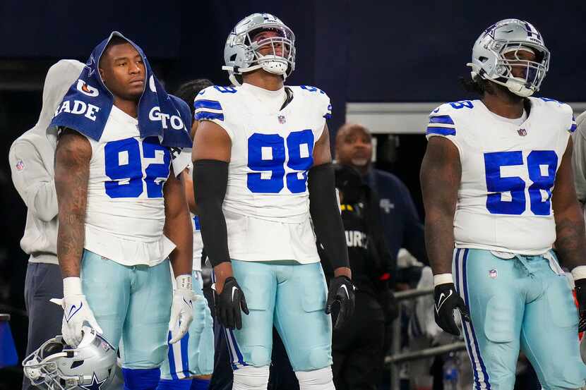 Dallas Cowboys defensive end Dorance Armstrong (92), defensive end Chauncey Golston (99) and...