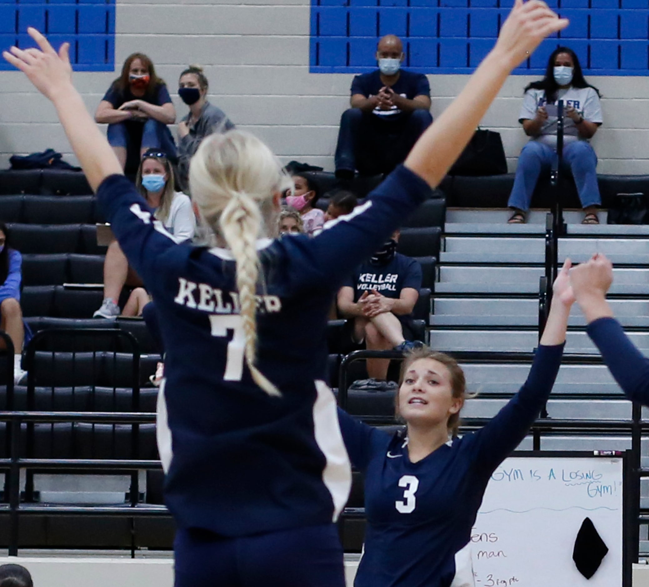 Keller's Landry McEachern (3) celebrates with teammates, including Kennedi Sutter (7)...