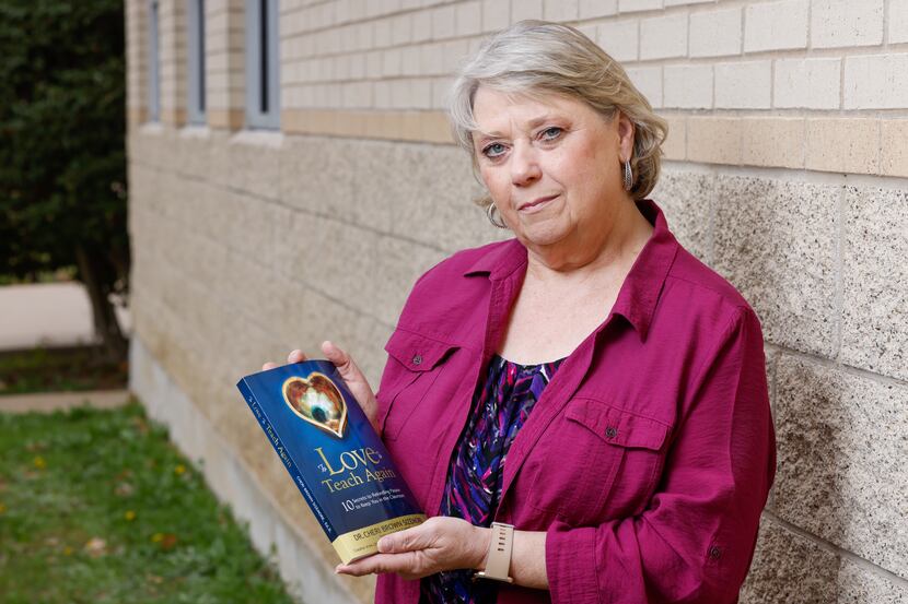Cheri Sizemore, a veteran educator and interim assistant principal, holds her book, “To Love...