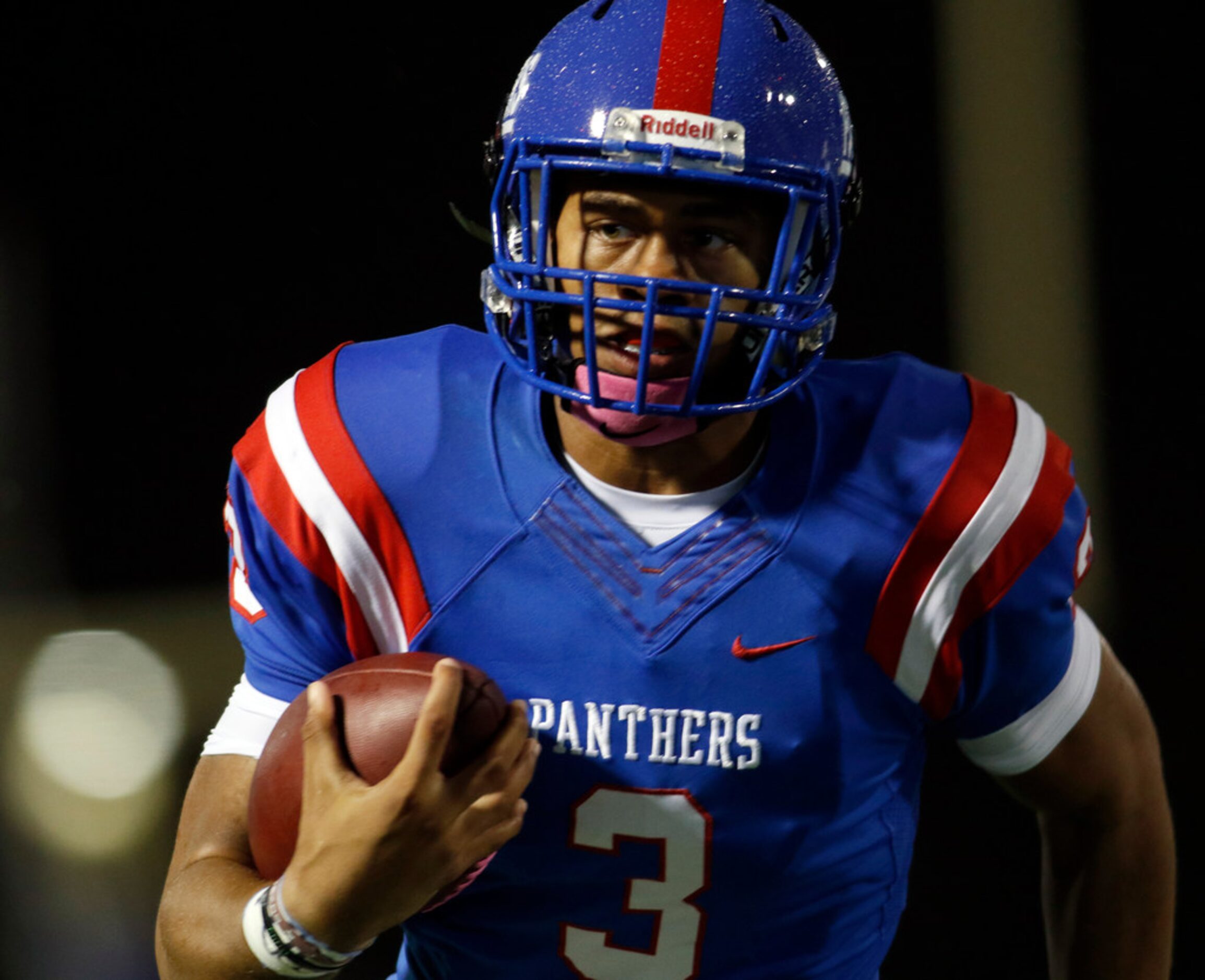 Duncanville Panthers quarterback Ja'Quinden Jackson (3) eyes the end zone as he cuts inside...