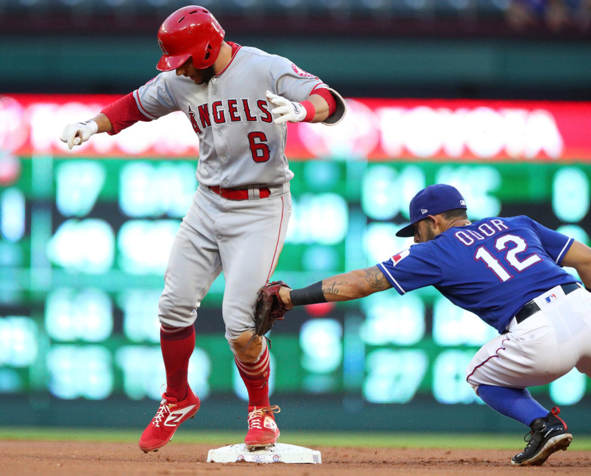 Los Angeles Angels' David Fletcher reaches second safely on a double as Texas Rangers second...