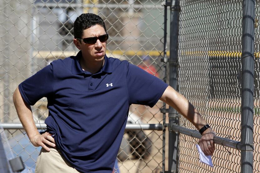 Texas Rangers President of Baseball Operations and General Manager, Jon Daniels, watches as...