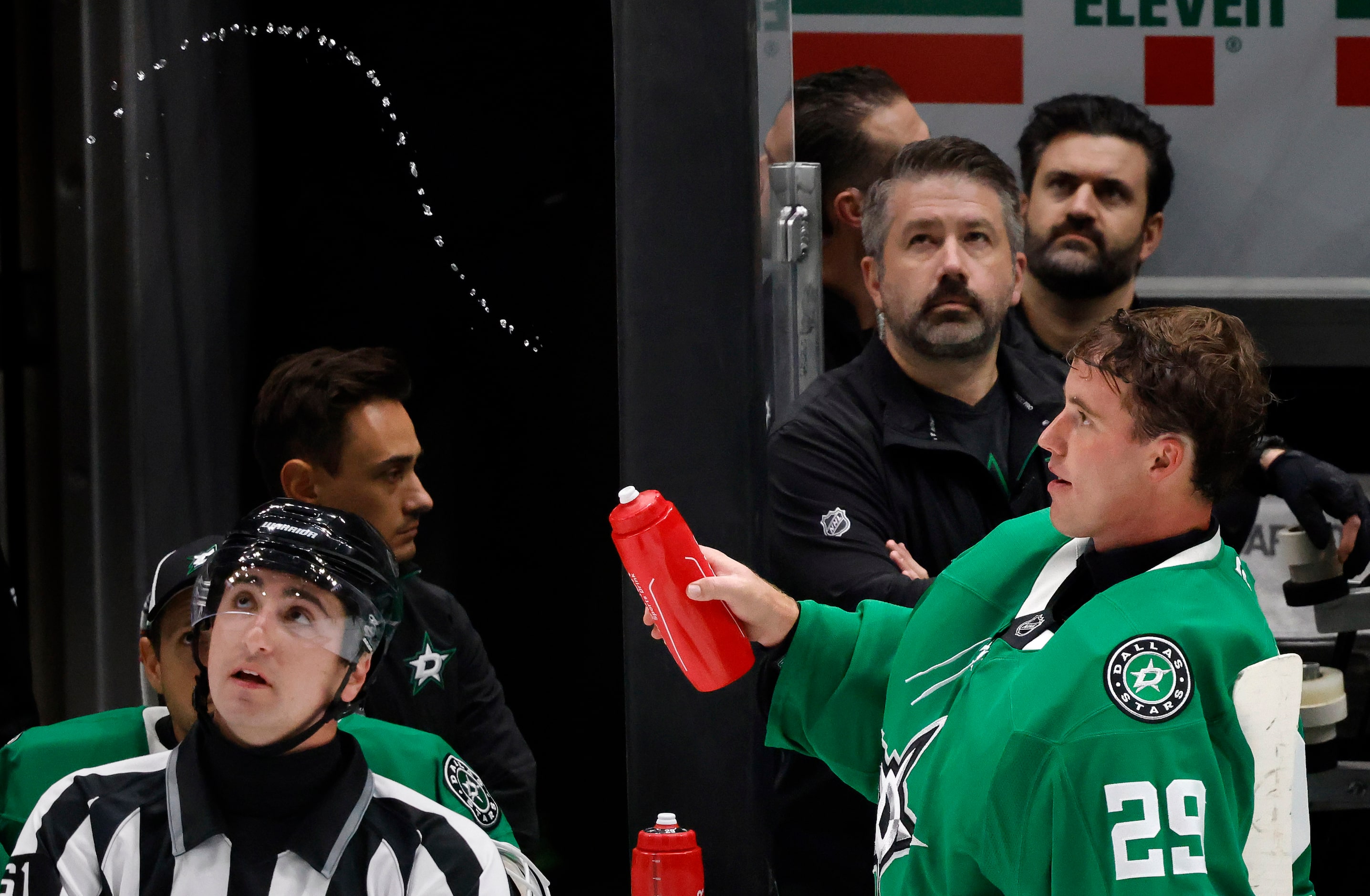 Dallas Stars goaltender Jake Oettinger (29) squirt the water bottle into the air during a...