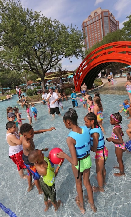 Young swimmers frolic at JadeWaters at the Hilton Anatole in Dallas. Moms and dads, there's...