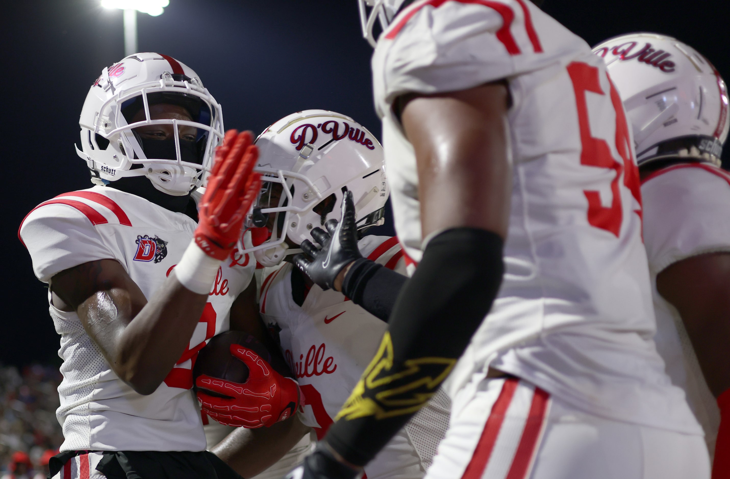 Duncanville receiver Zach Turner (9), left, celebrates with teammates after pulling in a...