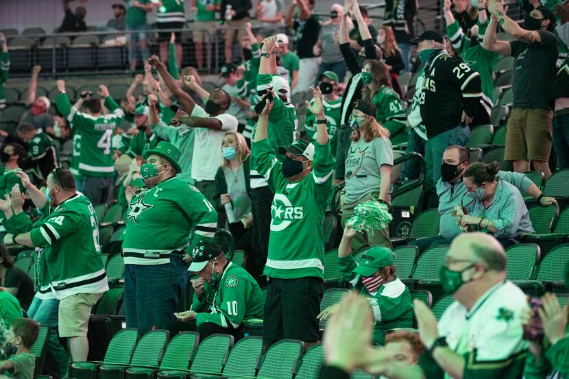 Stars fans react as the Dallas Stars scored a goal in the third period versus the Tampa Bay...