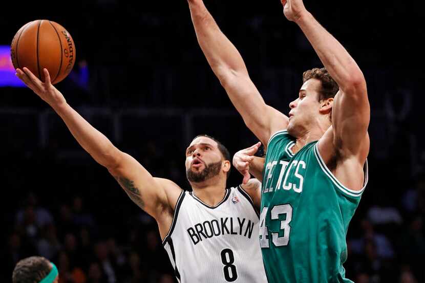 FILE - In this Dec. 10, 2013, file photo, Brooklyn Nets guard Deron Williams (8) looks to...