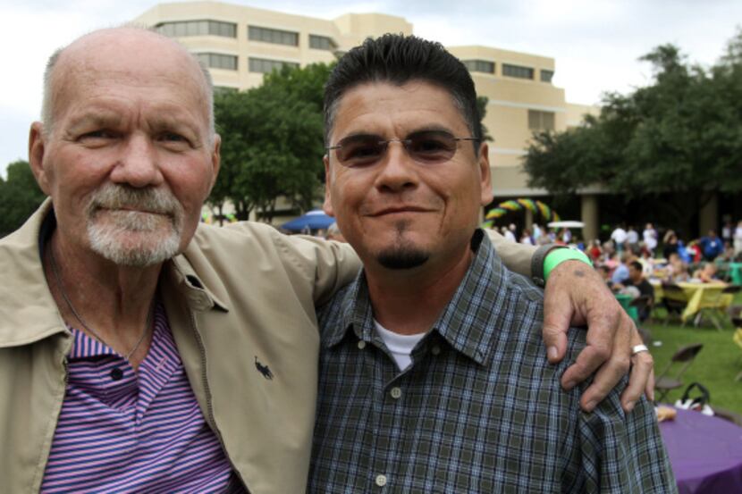 Larry Mooneyham (left), with Juan Espino at the reunion, received the liver of Espino’s wife...