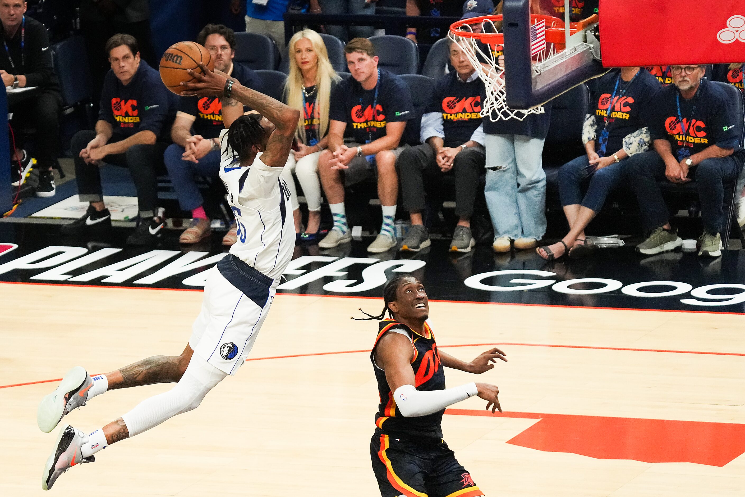 Dallas Mavericks forward Derrick Jones Jr. (55) dunks the ball past Oklahoma City Thunder...