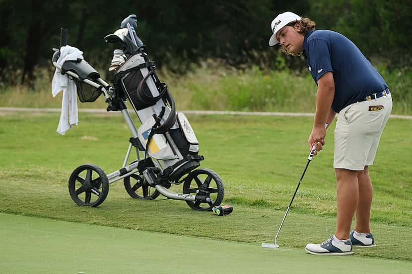 Brooks Simmons putts on his last hole during Day 2 of the UIL 6A boys golf state tournament...