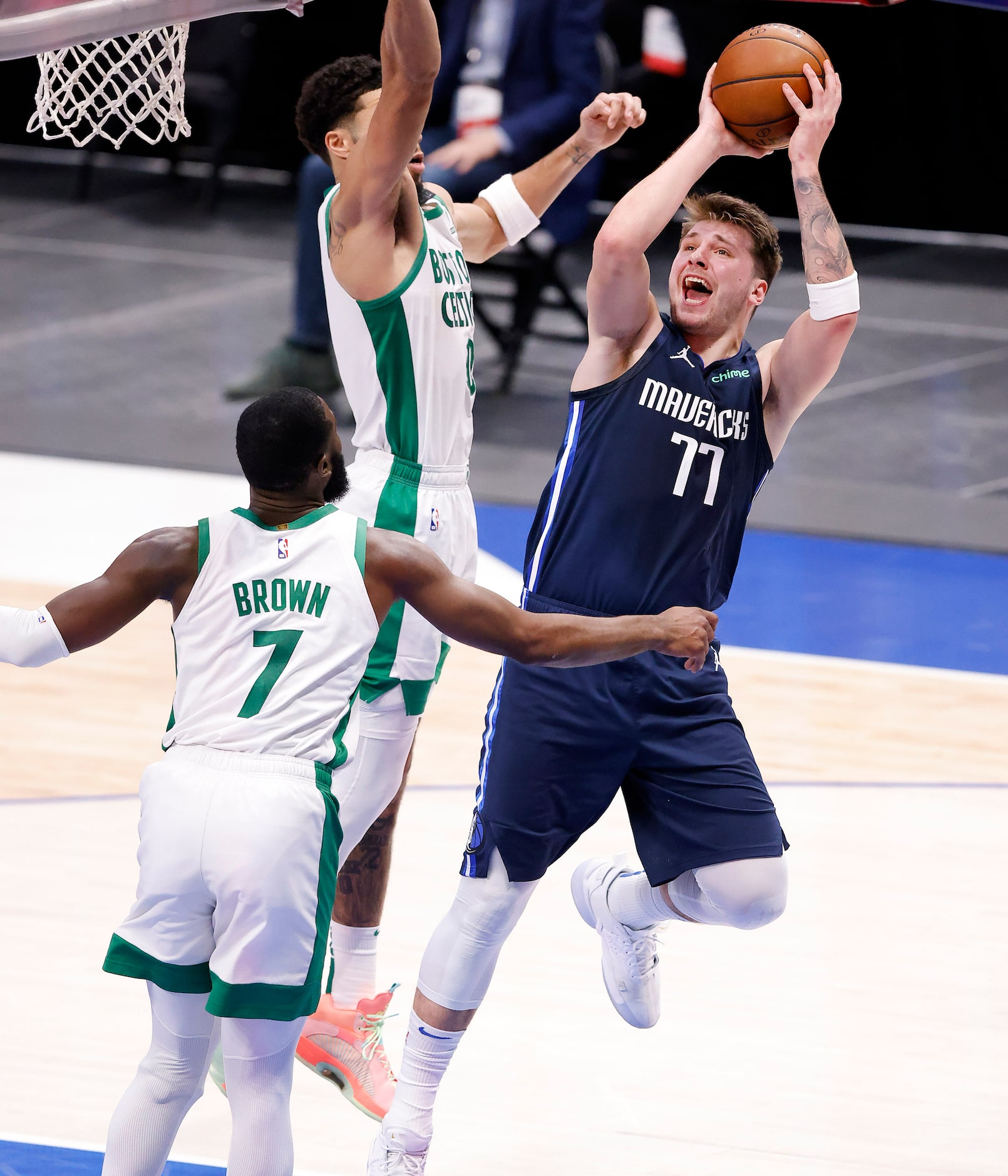 Dallas Mavericks guard Luka Doncic (77) puts up a second quarter jumper against Boston...