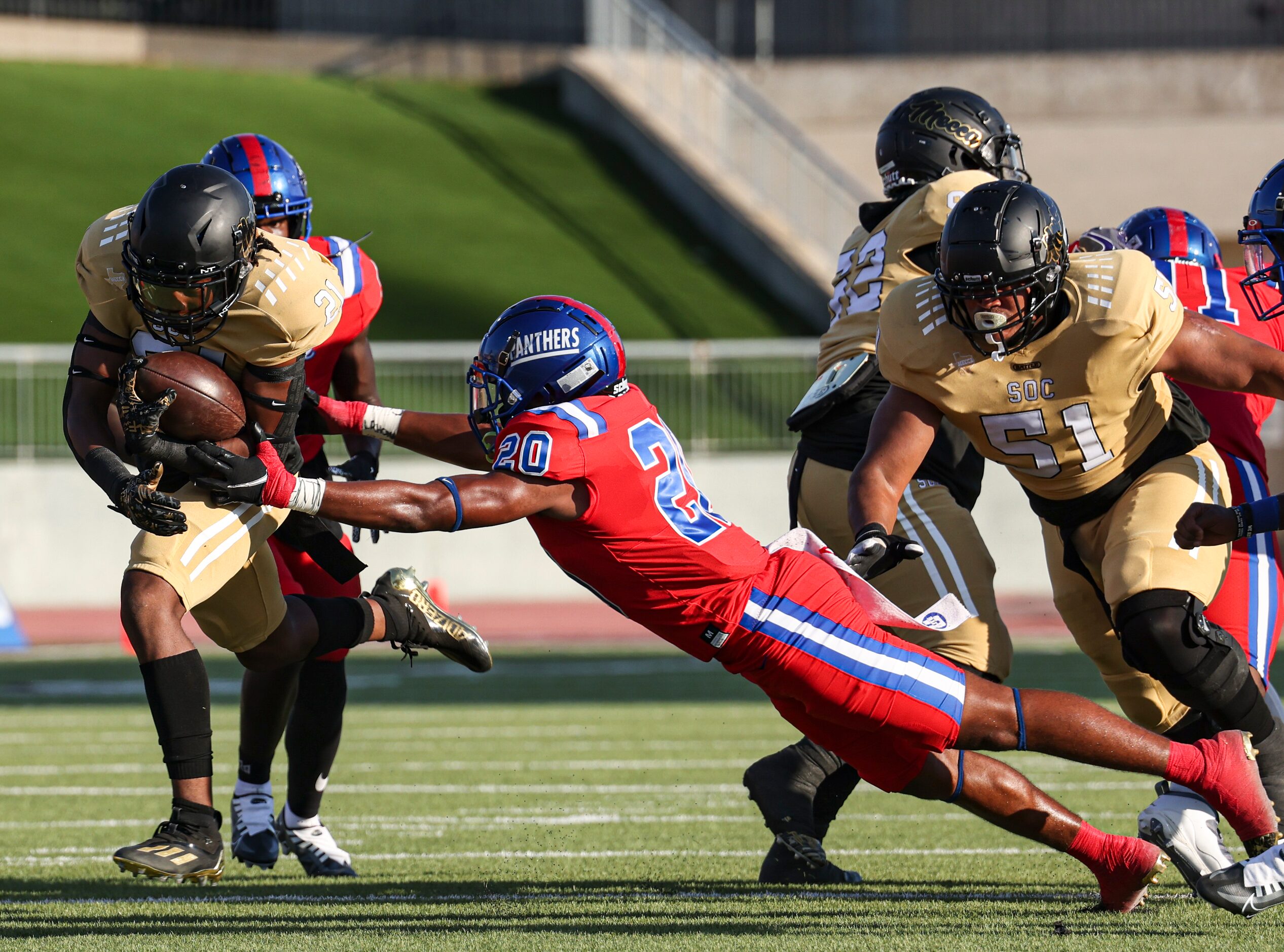 South Oak Cliff High School David Spruiells (21) runs the ball up the field as Duncanville...