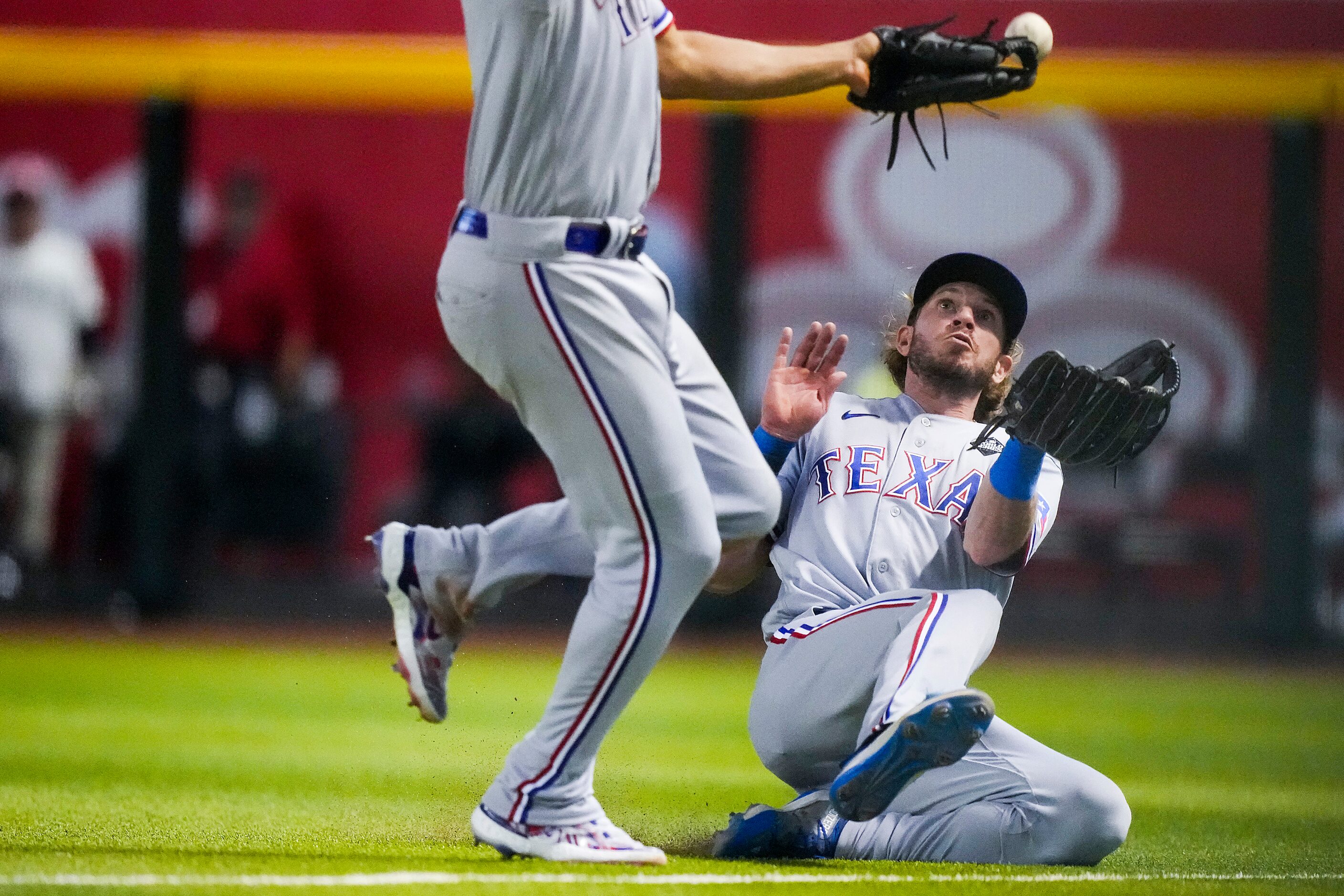 Texas Rangers right fielder Travis Jankowski makes a sliding catch on a fly ball off the bat...