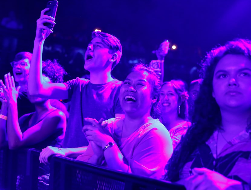 St. Paul & The Bone Breakers fans Jansen Sharp (left) and Amie Pinratana (middle) react to...