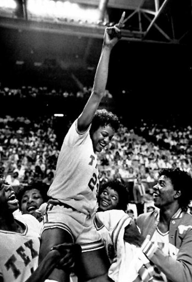 Texas forward Clarissa Davis is lifted  by her teammates March 30,1986 after they defeated...