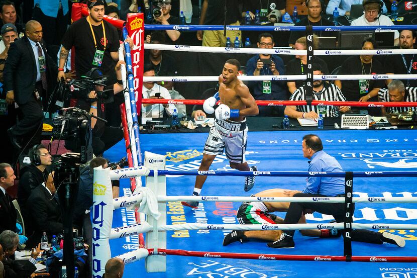 Welterweight champion Errol Spence Jr. celebrates after defending his IBF world title with a...