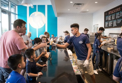 At Cow Tipping Creamery at The Star Frisco, anyone who orders a waffle cone eats it in a...