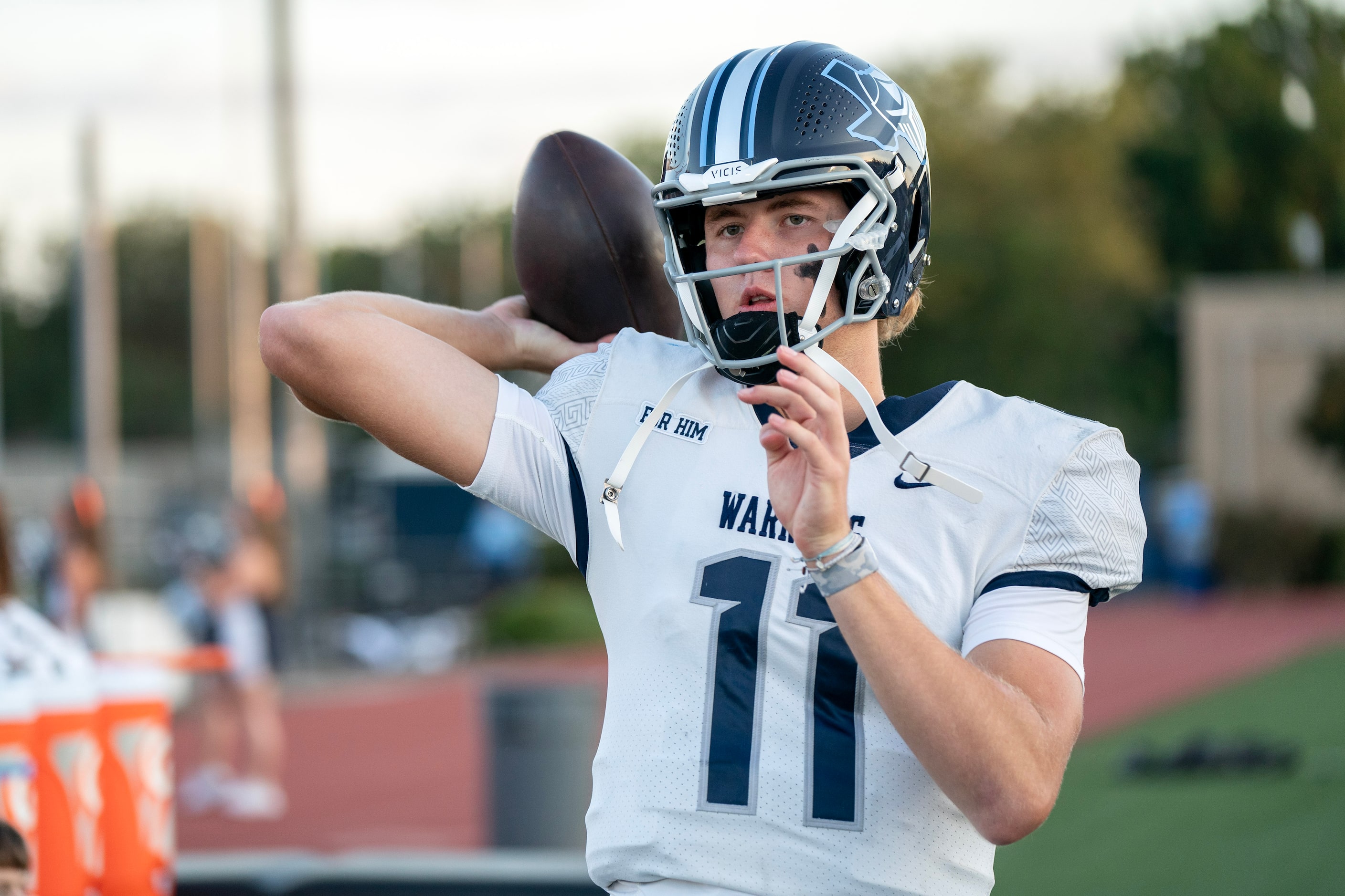 Argyle Liberty Christian senior quarterback Cole Welliver (11) warms up before a high school...