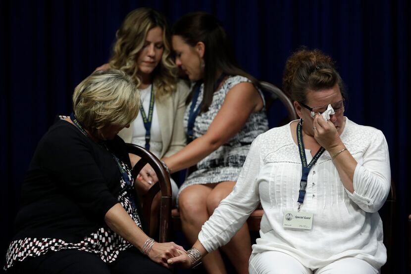 Victims of clergy sexual abuse or family members react as Pennsylvania Attorney General Josh...