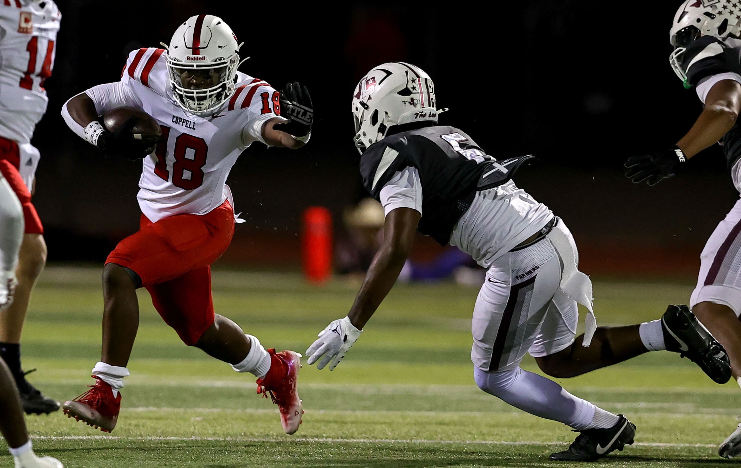 Coppell running back Josh Lock (18) tries to elude Lewisville linebacker Mac Curington (6)...