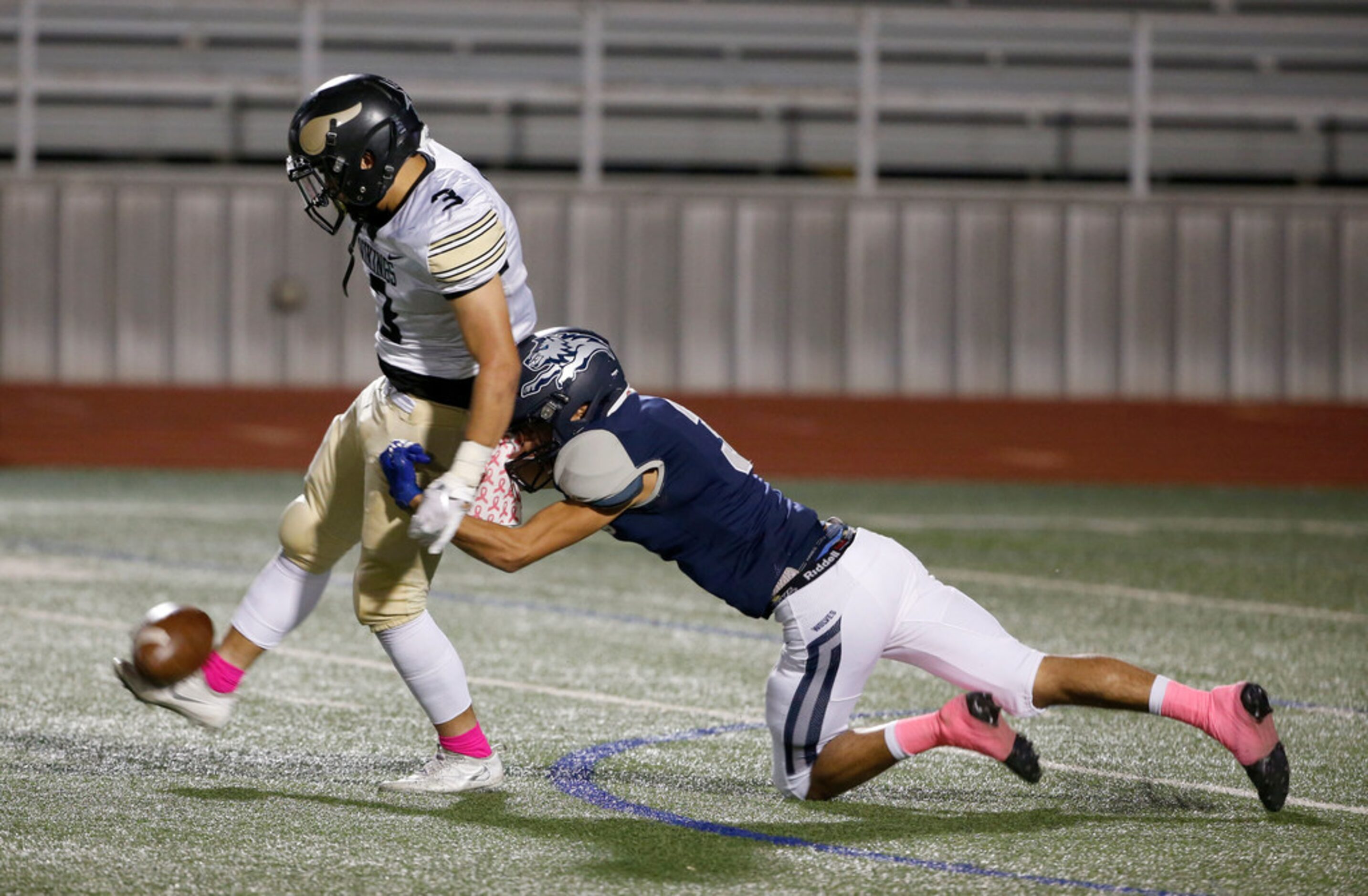 Ranchview's Bijan Khoshnoudi (3), right, pressures Pinkston punter Julian Olivo (3),...