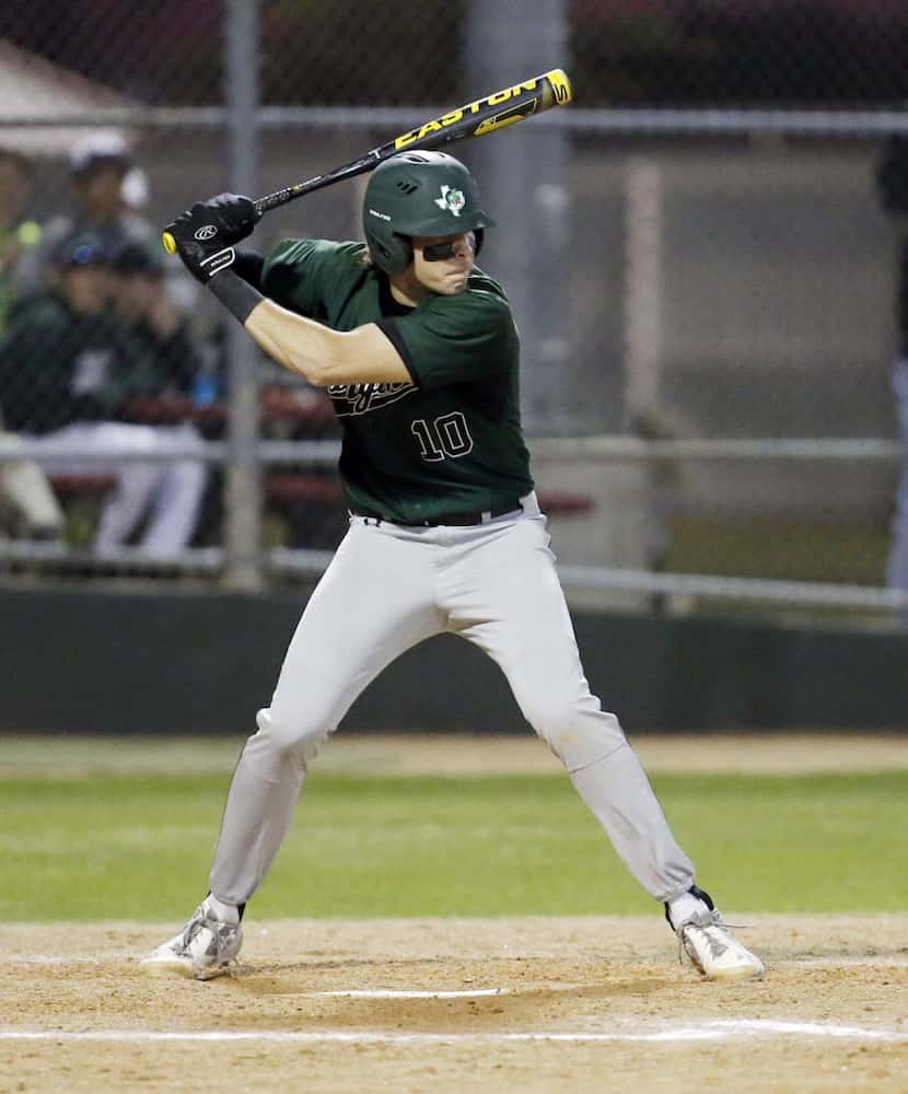 Southlake Carroll's Hudson Sanchez prepares bats against Coppell on Tuesday, March 22, 2016.