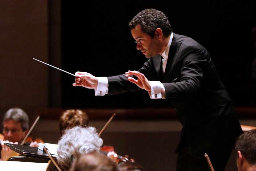 Guest conductor Andrew Grams leading the Dallas Symphony Orchestra in a performance of 'The...