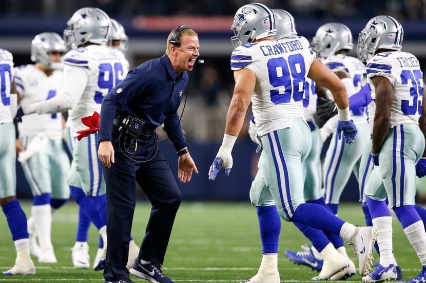 Dallas Cowboys head coach Jason Garrett celebrates with the team after a failed field goal...