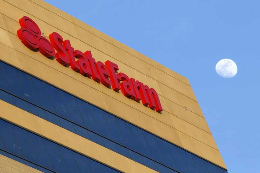 The moon rises behind Building Three at State Farm's CityLine Project in Richardson, Texas,...