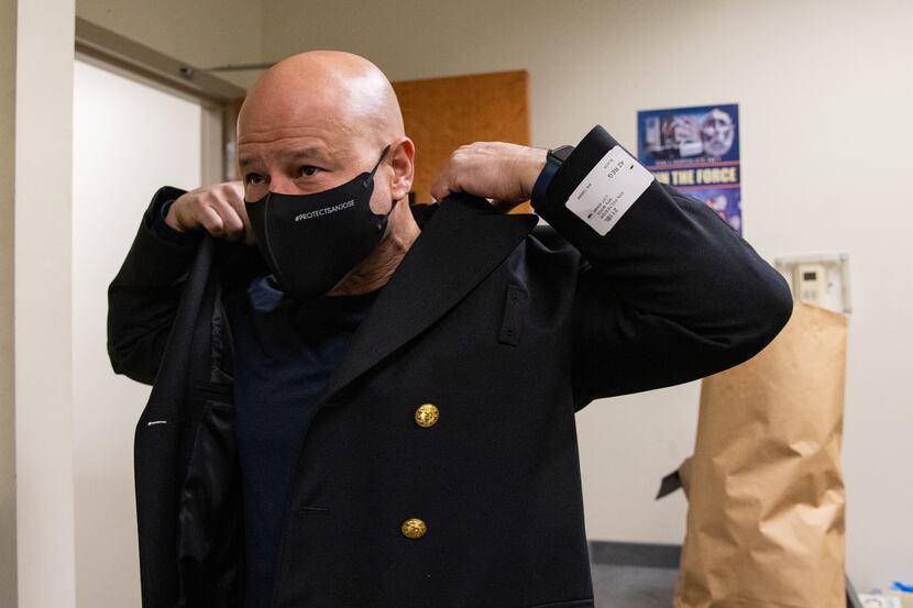 Dallas Police Chief Eddie Garcia tries on his uniform at DPD headquarters in Dallas on...