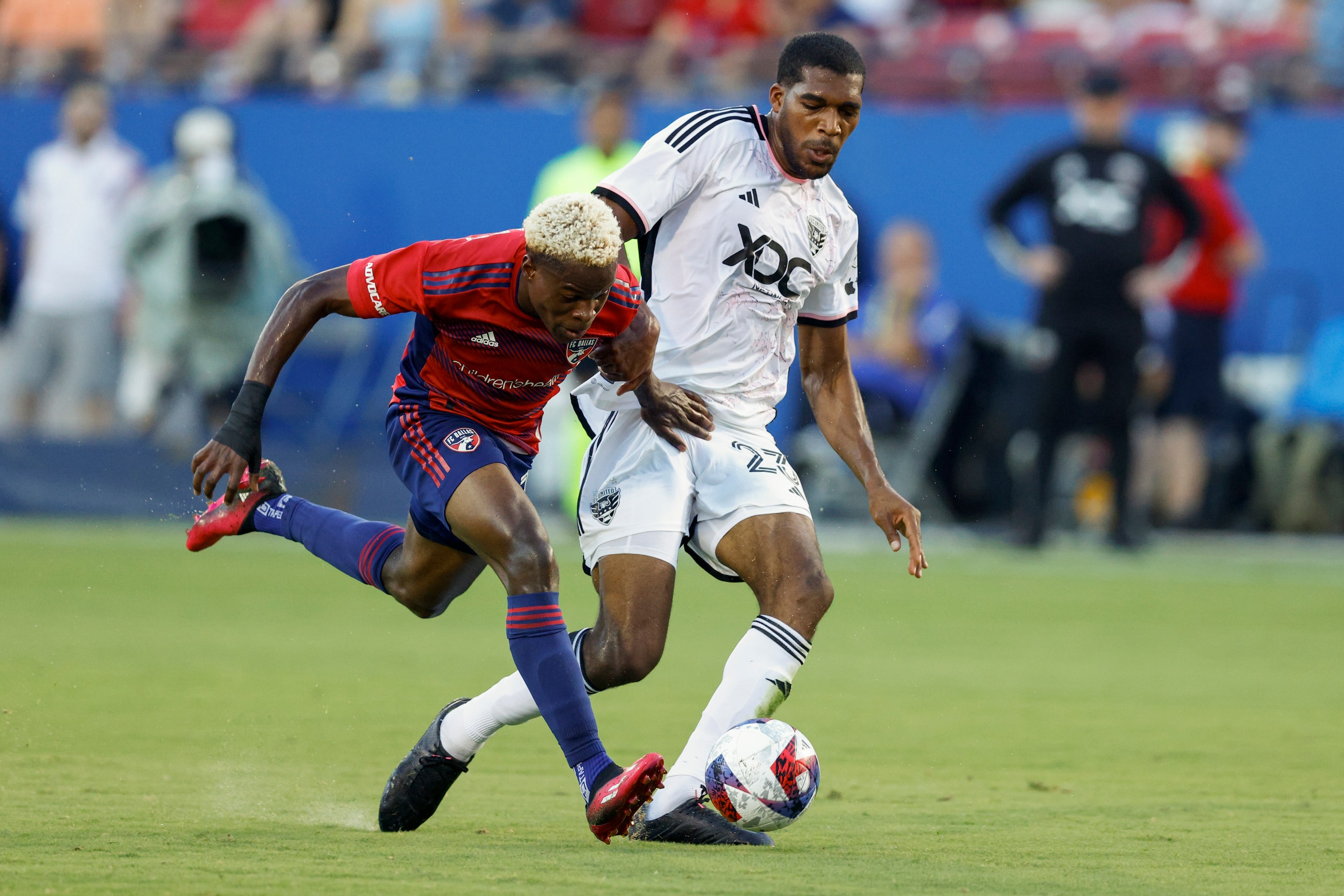 D.C. United defender Donovan Pines (23) tackles the ball away from FC Dallas forward Bernard...