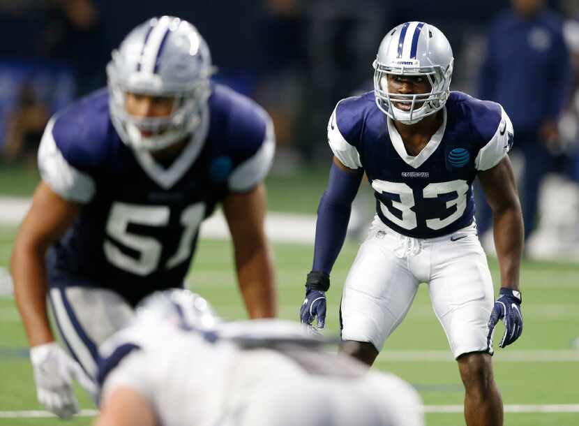 Dallas Cowboys cornerback Chidobe Awuzie (33) watches before the snap at practice during...