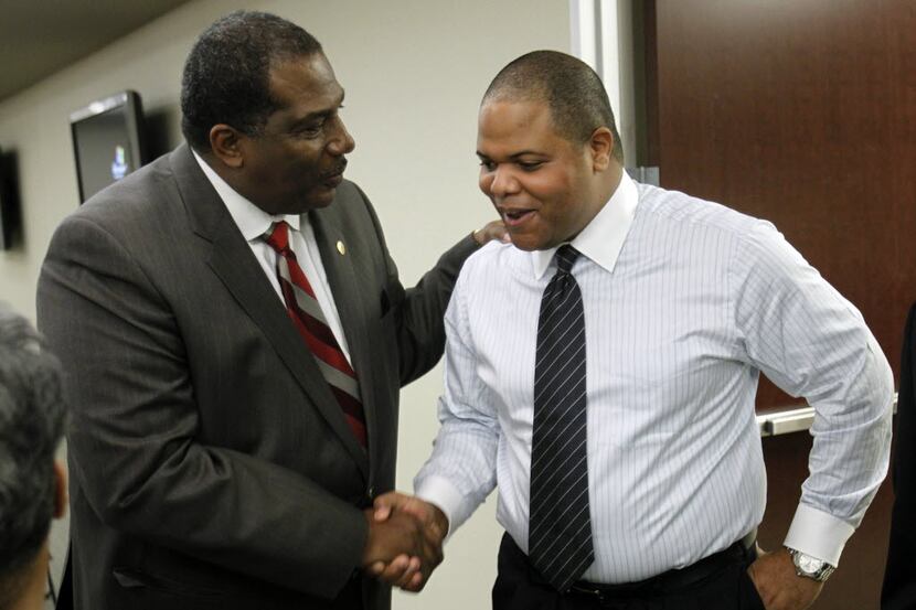 Rep. Eric Johnson (right), D-Dallas is congratulated by State Sen. Royce West at a lunch at...