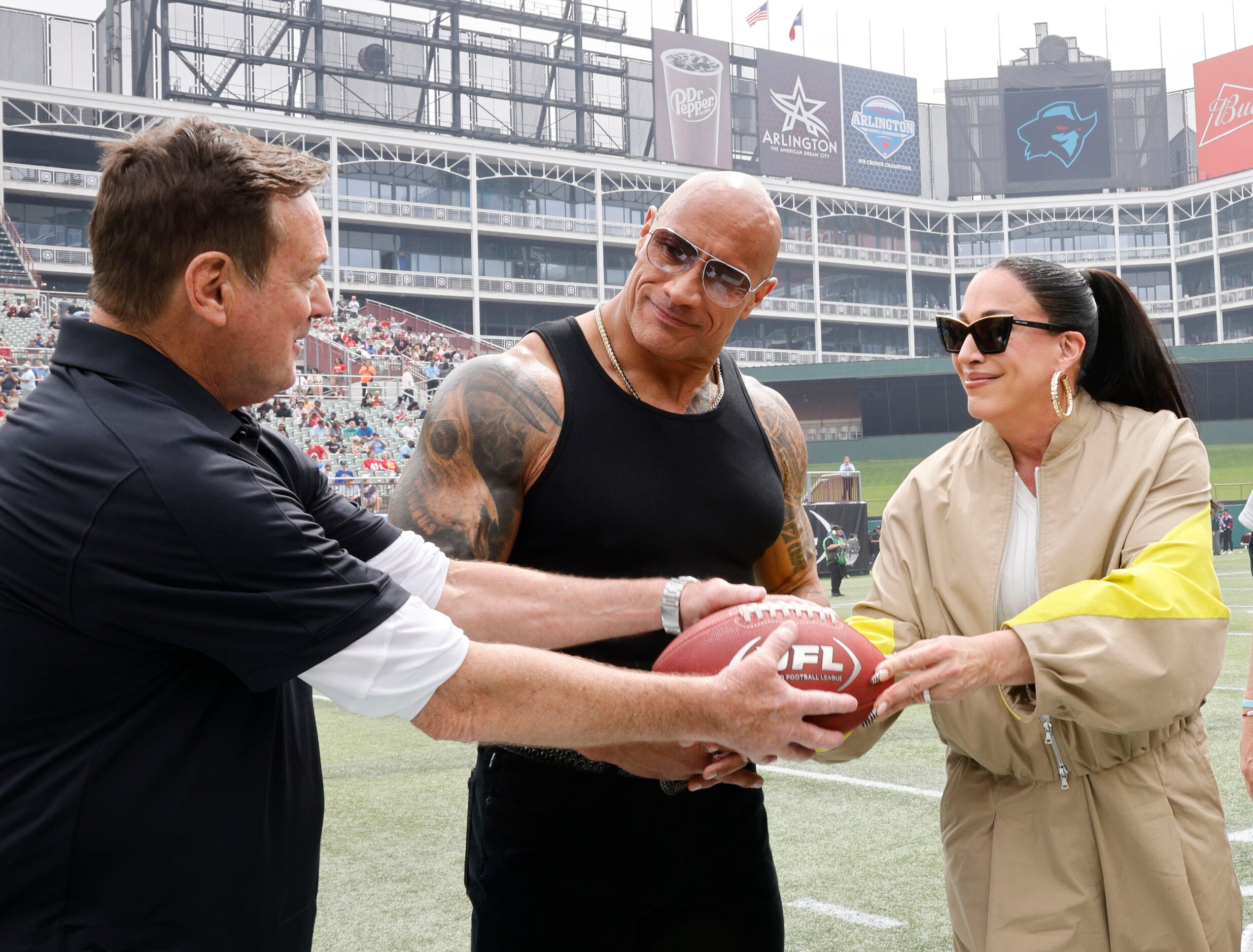 Arlington Renegades head coach Bob Stoops, from left, UFL owners Dwayne "The Rock" Johnson...